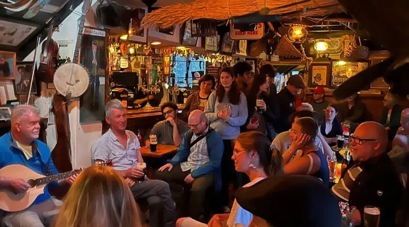 Packed pub interior during a busy music session